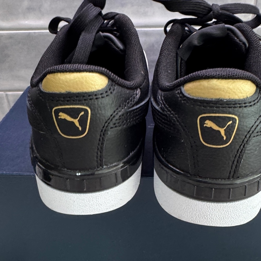 Puma black and gold platform sneakers Women’s size 6.5 NWOT